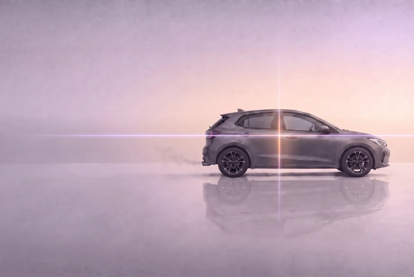 The same hatchback mid-repair: smoke almost gone, tyres inflated, a thin line of light scanning across it