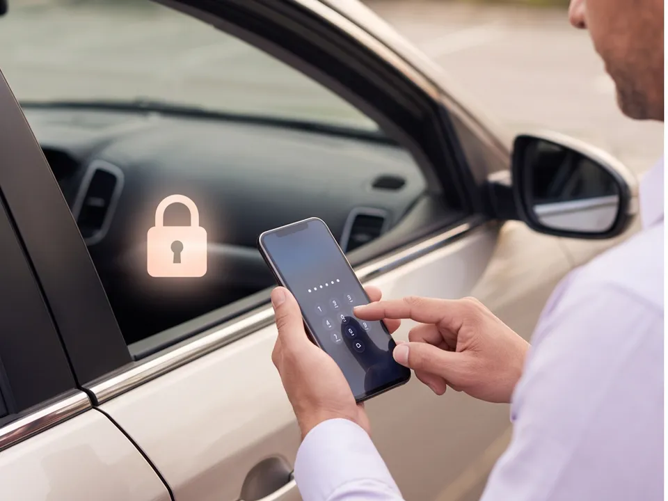 A person unlocking a phone with a passcode beside a parked car, a padlock symbol glowing softly